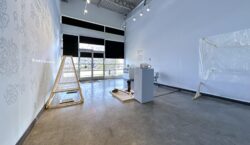 View of a memory with you exhibition from the exit from the media lab, facing south towards the front entrance.
